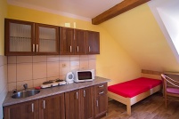 A room with a kitchenette